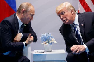Vladimir Putin and Donald Trump talk during their meeting in 2017